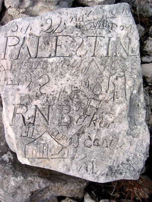 This is quite an elaborate carving with Palestine at the top and the name R N Bacon and dated