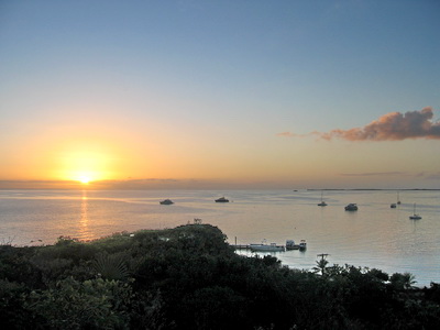 View of boats at anchor at Sapodilla Bay from the top of the hill