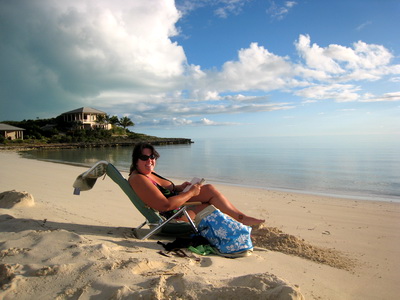 Kristi loves this little beach and reads her book and cools off in the water.