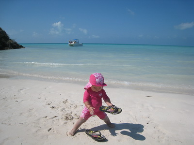 Malaika is just starting to walk and loves playing in the sand.