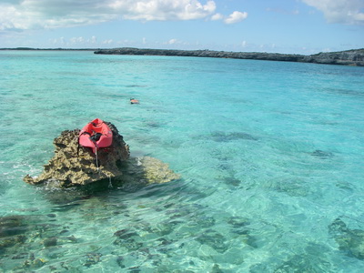 Recent guests put one of the kayaks up on a rock out cropping while they snorkeled the clear waters out in Cooper Jack Bay close to our villas