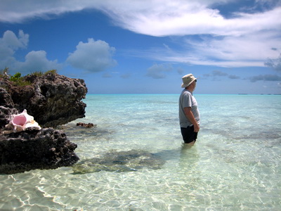 A visiting friend stops to take in the breathtaking ocean colours of turquoise, aqua and blue as I snapped his picture.