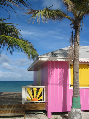 A sunburst of colour .......... pink, yellow, orange, turquoise and green adorn these charming beach huts where Sailing Paradise Restaurant is to be found out in Blue Hills.