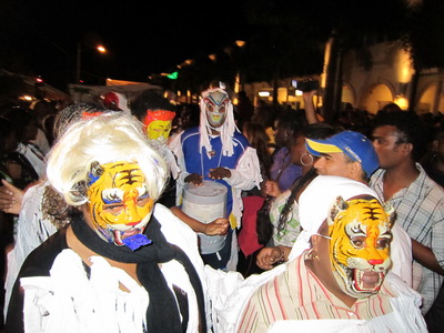 Young and old came out to watch the masked revellers as they paraded and danced their way down Grace Bay Road.