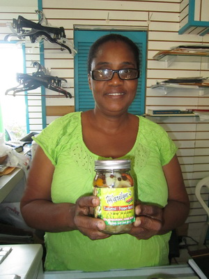Marilyn and a sealer of Tamarind hot pepper sauce that she made and brought into her shop for us.