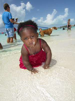 This little island miss absolutely loved playing in the water, red dress and all.