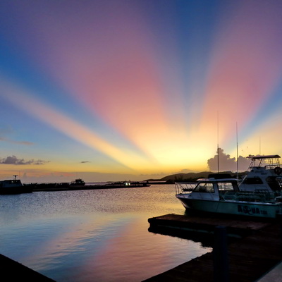 Sunset and boats in the marina at villa vacation rentals at Harbour Club Villas and Marina on Providenciales Turks and Caicos Islands