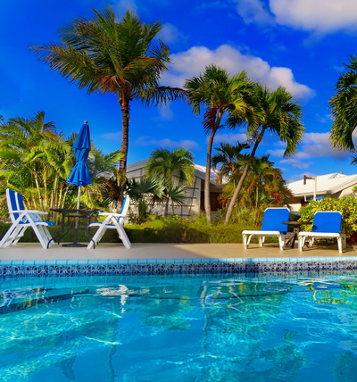 Pool and lounge chairs for relaxing at villa vacation rentals at Harbour Club Villas and Marina on Providenciales Turks and Caicos Islands